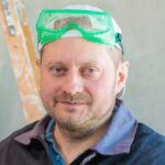 an electrician drinks tea during his lunch break at the enterprise. close up